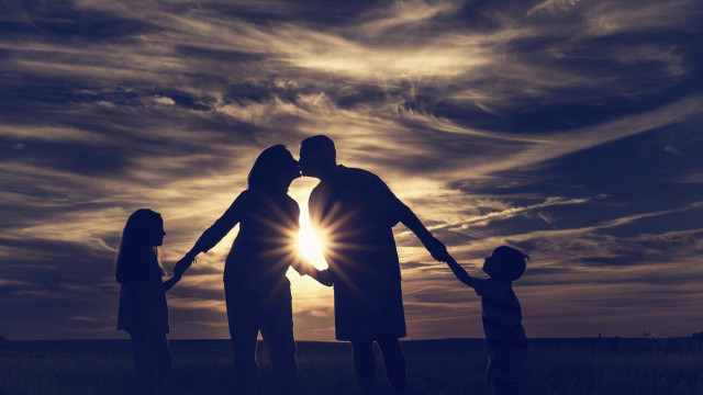 Family holding hands field sunset free wallpaper - medium preview image