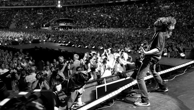 Man stage guitar crowd stadium free wallpaper - medium preview image