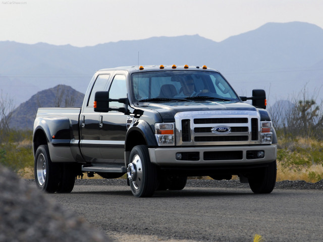 Truck driving road mountains sky free wallpaper - medium preview image