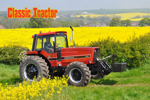 Classic tractor parked field yellow free wallpaper - medium preview image