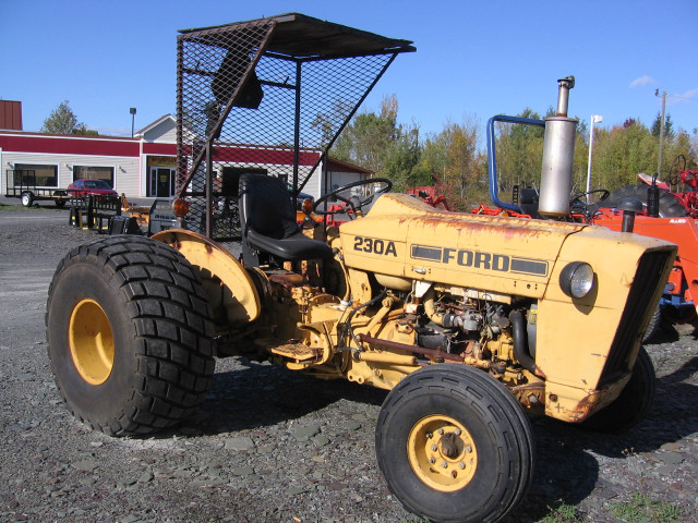 Tractor parked lot building tree free wallpaper - medium preview image