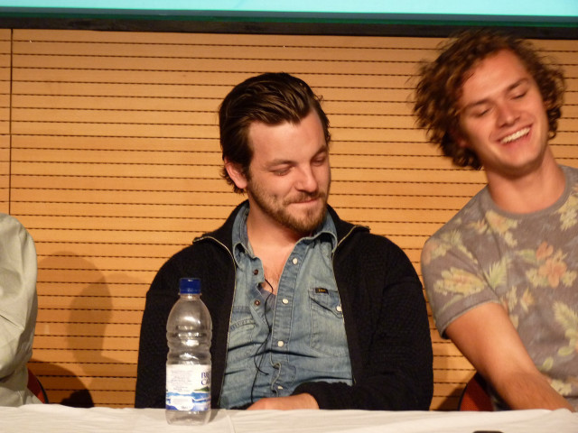 Three men sitting table water free wallpaper - medium preview image