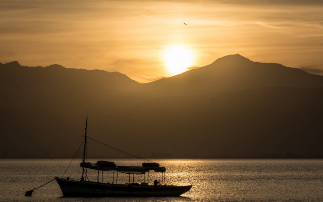 Boat lake sunset mountains bird free wallpaper - medium preview image