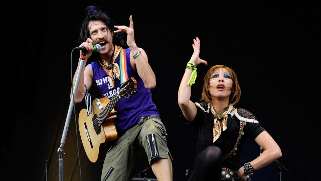 Man woman singing microphones stage free wallpaper - medium preview image