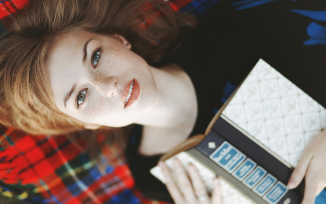 Woman holding cookies smiling plaid free wallpaper - medium preview image