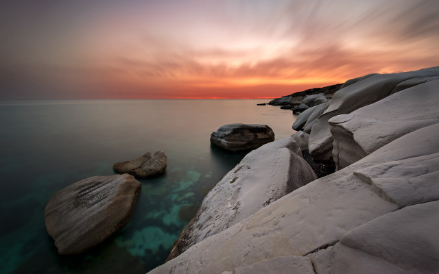 Rocky shore sunset clouds mountains free wallpaper - medium preview image
