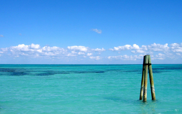 Wooden pole ocean sky clouds #4 free wallpaper - medium preview image
