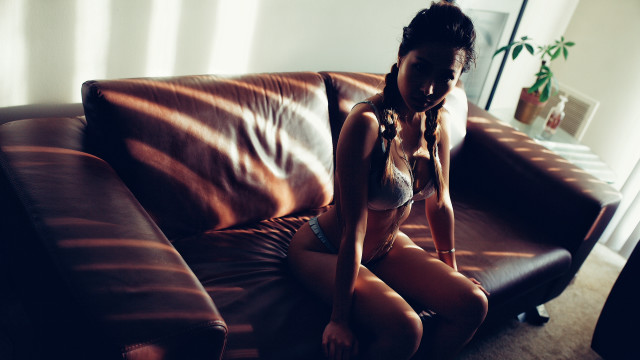Woman bikini couch livingroom plant free wallpaper - medium preview image