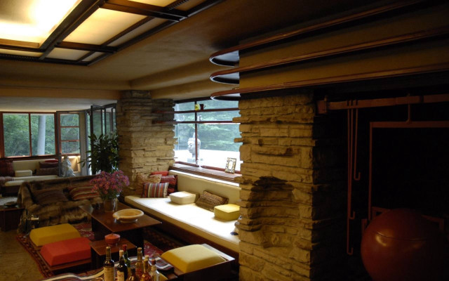 Livingroom stonefireplace largewindow waterview mackintosh free wallpaper - medium preview image