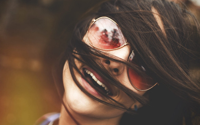 Woman sunglasses wind blown hair free wallpaper - medium preview image