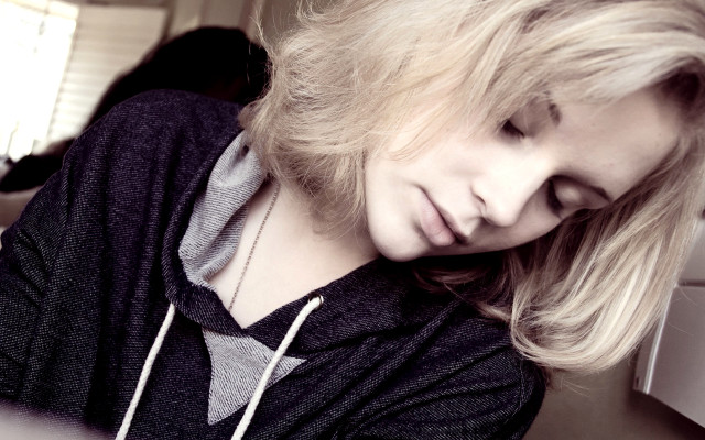 Blonde woman cellphone black shirt free wallpaper - medium preview image