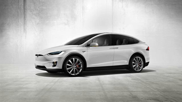 White tesla electric car concrete free wallpaper - medium preview image