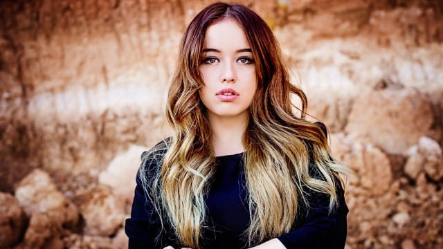 Woman long hair rock wall #2 free wallpaper - medium preview image