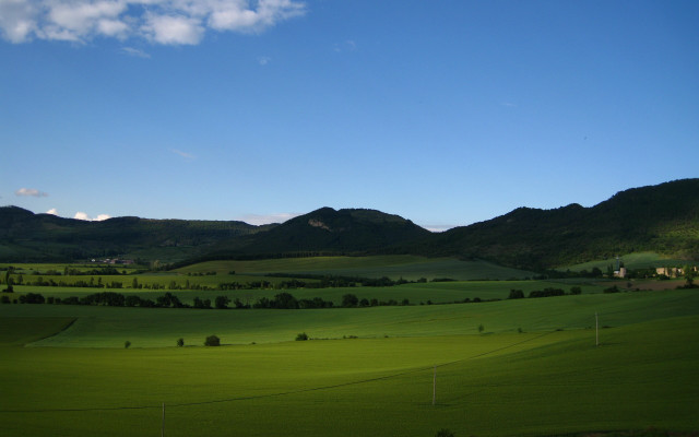 Green field mountains clouds sky free wallpaper - medium preview image