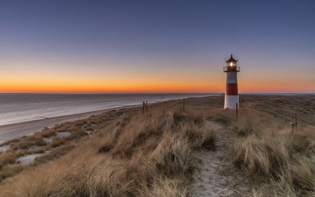 Lighthouse grassy hill ocean sunset #2 free wallpaper - medium preview image