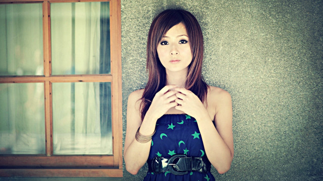 Woman standing window hands folded free wallpaper - medium preview image