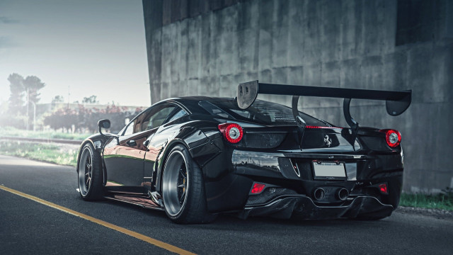 Black sports car driving building free wallpaper - medium preview image