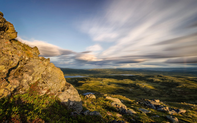 Rocky outcropping lake cloudy sky free wallpaper - medium preview image