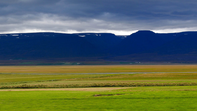 Horse grazing mountains water sunset free wallpaper - medium preview image