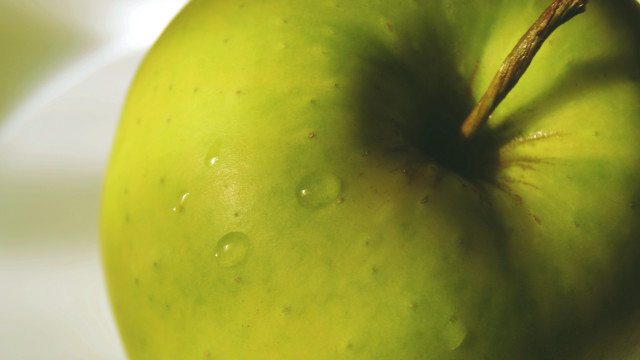 Green apple water droplets macro free wallpaper - medium preview image
