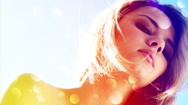 Woman blowing hair bokeh sunlight free wallpaper - medium preview image