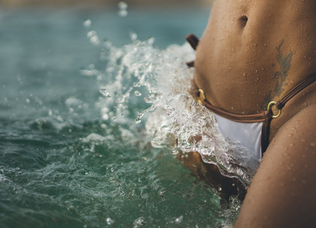 Woman bikini water hands in free wallpaper - medium preview image