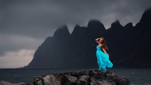 Woman blue dress rocks ocean free wallpaper - medium preview image