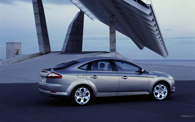 Silver car building sculpture clouds free wallpaper - medium preview image