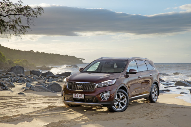 Brown suv beach ocean rocks free wallpaper for desktop - medium preview image