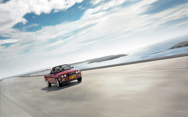 Red car ocean sky beach free wallpaper - medium preview image