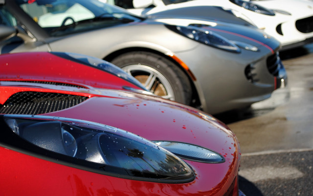 Red sports car closeup parking free wallpaper - medium preview image