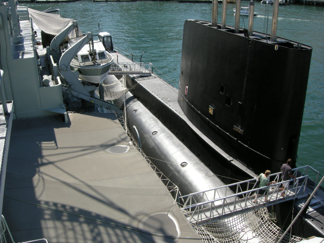 Submarine docked man deck water free wallpaper - medium preview image
