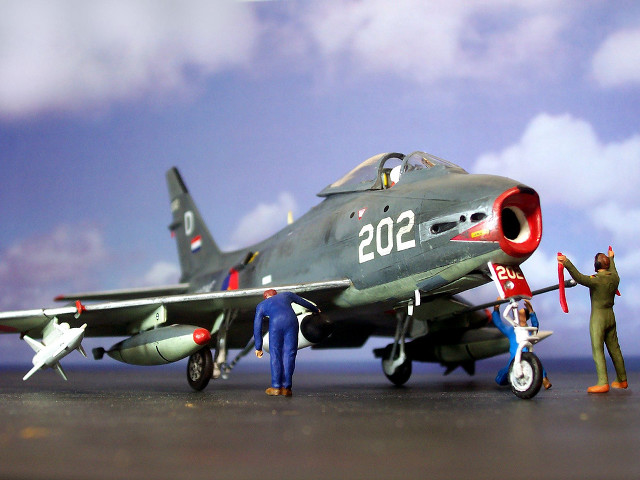 Toy model fighter jet men free wallpaper - medium preview image