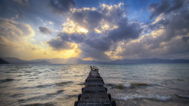 Pier ocean sunset light rays free wallpaper - medium preview image