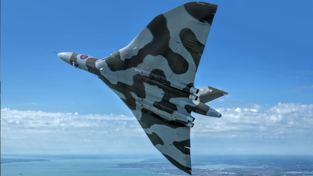 Camouflaged fighter jet blue sky free wallpaper - medium preview image