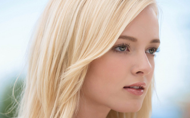 Blonde blue eyed serious woman free wallpaper - medium preview image