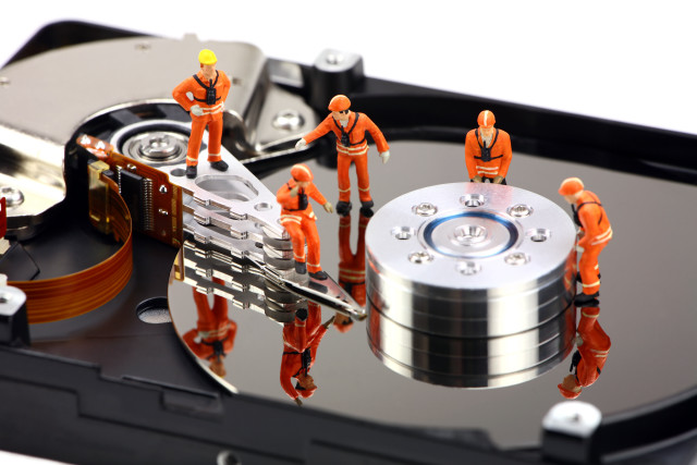 Hard drive small people standing free wallpaper - medium preview image