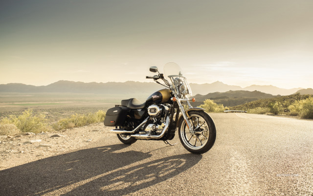 Motorcycle parked road mountains grass free wallpaper - medium preview image