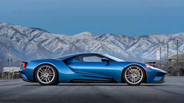 Blue sports car mountains sky free wallpaper - medium preview image