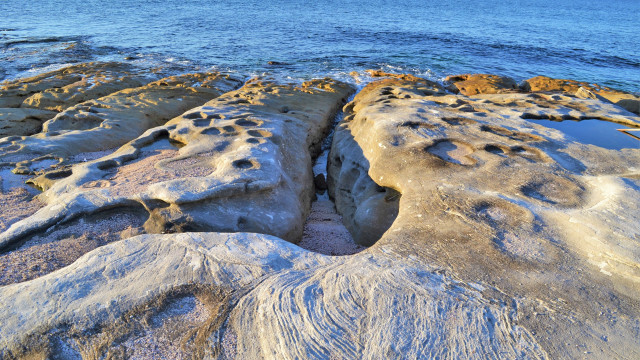 Rock formation water ice shore free wallpaper - medium preview image