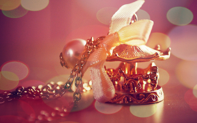 Gold necklace bow pearls bokeh free wallpaper - medium preview image