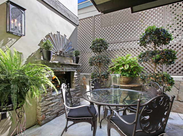 Patio table chairs fireplace overgrown free wallpaper - medium preview image