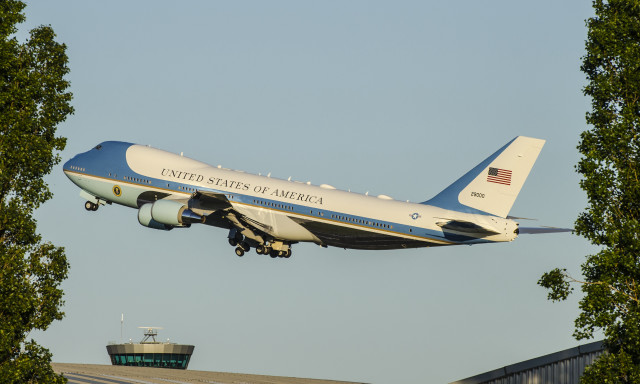 Jetliner blue sky trees building free wallpaper - medium preview image