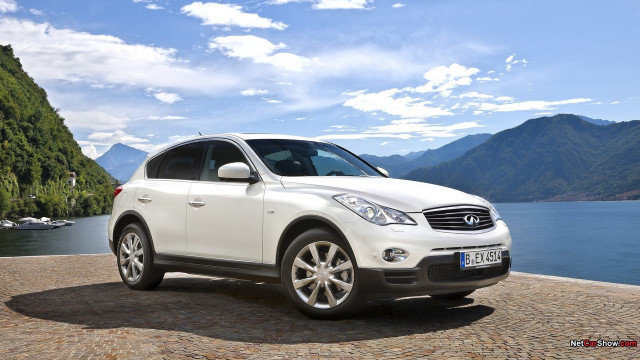 White car cobblestone road mountains free wallpaper - medium preview image