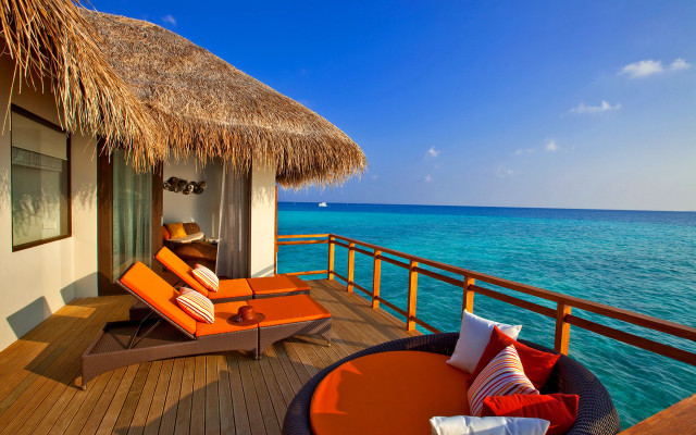 Lounge deck ocean thatched roof free wallpaper - medium preview image