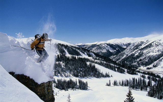 Man skier jumping cliff mountains free wallpaper - medium preview image
