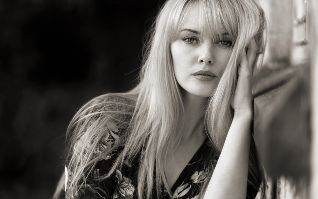 Woman leaning wall serious fiona free wallpaper - medium preview image