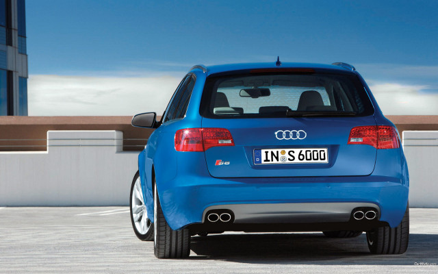 Blue car parked parking lot free wallpaper - medium preview image