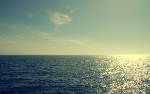 Ocean sky clouds boat shore free wallpaper - medium preview image