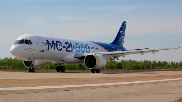 Jetliner runway forest sunny day free wallpaper - medium preview image